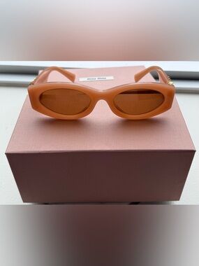 Beautiful Miu Miu pink acetate oval sunglasses
